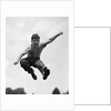 950s Boy Jumping Up by Anonymous