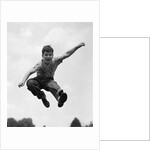 950s Boy Jumping Up by Anonymous