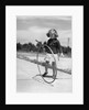 1930s Girl Playing With Hoop And Stick On Sidewalk by Anonymous