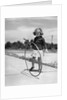 1930s Girl Playing With Hoop And Stick On Sidewalk by Anonymous