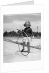 1930s Girl Playing With Hoop And Stick On Sidewalk by Anonymous