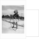 1930s Girl Playing With Hoop And Stick On Sidewalk by Anonymous