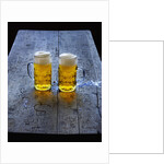 Two Glass Mugs of Beer on Table by Anonymous