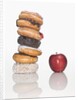 Stack of Donuts and One Apple by Anonymous