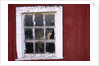 Cat sitting in a barn window by Anonymous