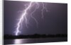 Lightning Striking Ground Near Residential Lake by Anonymous