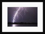 Lightning Striking Ground Near Residential Lake by Anonymous