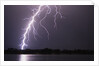 Lightning Striking Ground Near Residential Lake by Anonymous