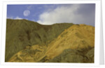 Full moon setting over mountain in Kluane National Park by Anonymous