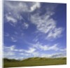 Lofty cumulus and cirrus clouds over sagebrush prairie by Anonymous