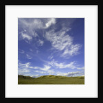 Lofty cumulus and cirrus clouds over sagebrush prairie by Anonymous