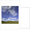 Lofty cumulus and cirrus clouds over sagebrush prairie by Anonymous