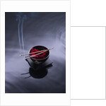 Burning incense on top of bowl of petals by Anonymous