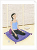 Woman Meditating on Blue Pillow by Anonymous