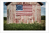 American flag painted on barn by Anonymous