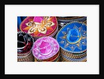 Stacks of souvenir sombreros by Anonymous