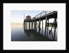 Fishing pier at low tide in a calm bay by Anonymous