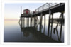 Fishing pier at low tide in a calm bay by Anonymous