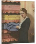 Woman puting away blanket in linen closet by Anonymous