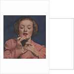 Woman putting on lipstick by Anonymous