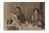 Husband and wife at breakfast by Anonymous