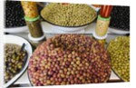 Olive stand in a souk in the medina in Marrakech by Anonymous