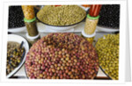 Olive stand in a souk in the medina in Marrakech by Anonymous
