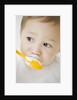 Boy having ice cream with spoon by Anonymous