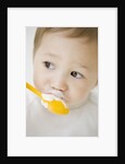 Boy having ice cream with spoon by Anonymous