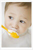 Boy having ice cream with spoon by Anonymous
