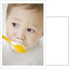 Boy having ice cream with spoon by Anonymous