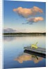 Clouds reflected in Silent Lake with Muskoka chair on dock by Anonymous