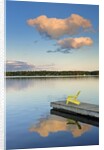 Clouds reflected in Silent Lake with Muskoka chair on dock by Anonymous