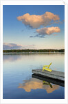 Clouds reflected in Silent Lake with Muskoka chair on dock by Anonymous