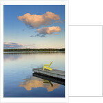 Clouds reflected in Silent Lake with Muskoka chair on dock by Anonymous
