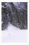 Backcountry Skier Underneath Snowpatch Spire, Bugaboos, British Columbia, Canada. by Anonymous
