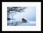 Snow covered pier and boat house at Lake Starnberg by Anonymous