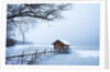 Snow covered pier and boat house at Lake Starnberg by Anonymous