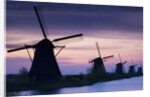 Row of windmills at sunrise in the Netherlands by Anonymous