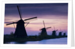Row of windmills at sunrise in the Netherlands by Anonymous