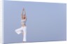 Young woman stretching by Anonymous
