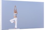 Young woman stretching by Anonymous