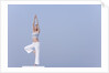 Young woman stretching by Anonymous