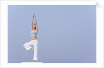 Young woman stretching by Anonymous