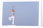 Young woman stretching by Anonymous