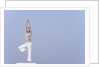 Young woman stretching by Anonymous