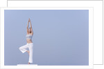 Young woman stretching by Anonymous