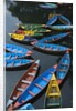 Canoes floating on water by Anonymous