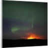 Aurora Borealis over eruption at Eyjafjallajokull glacier by Anonymous