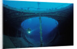 Scuba diver exploring a shipwreck, Papua New Guinea, Coral Sea. by Anonymous